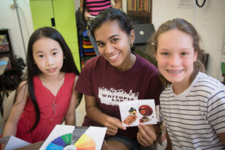 Three girls smiling